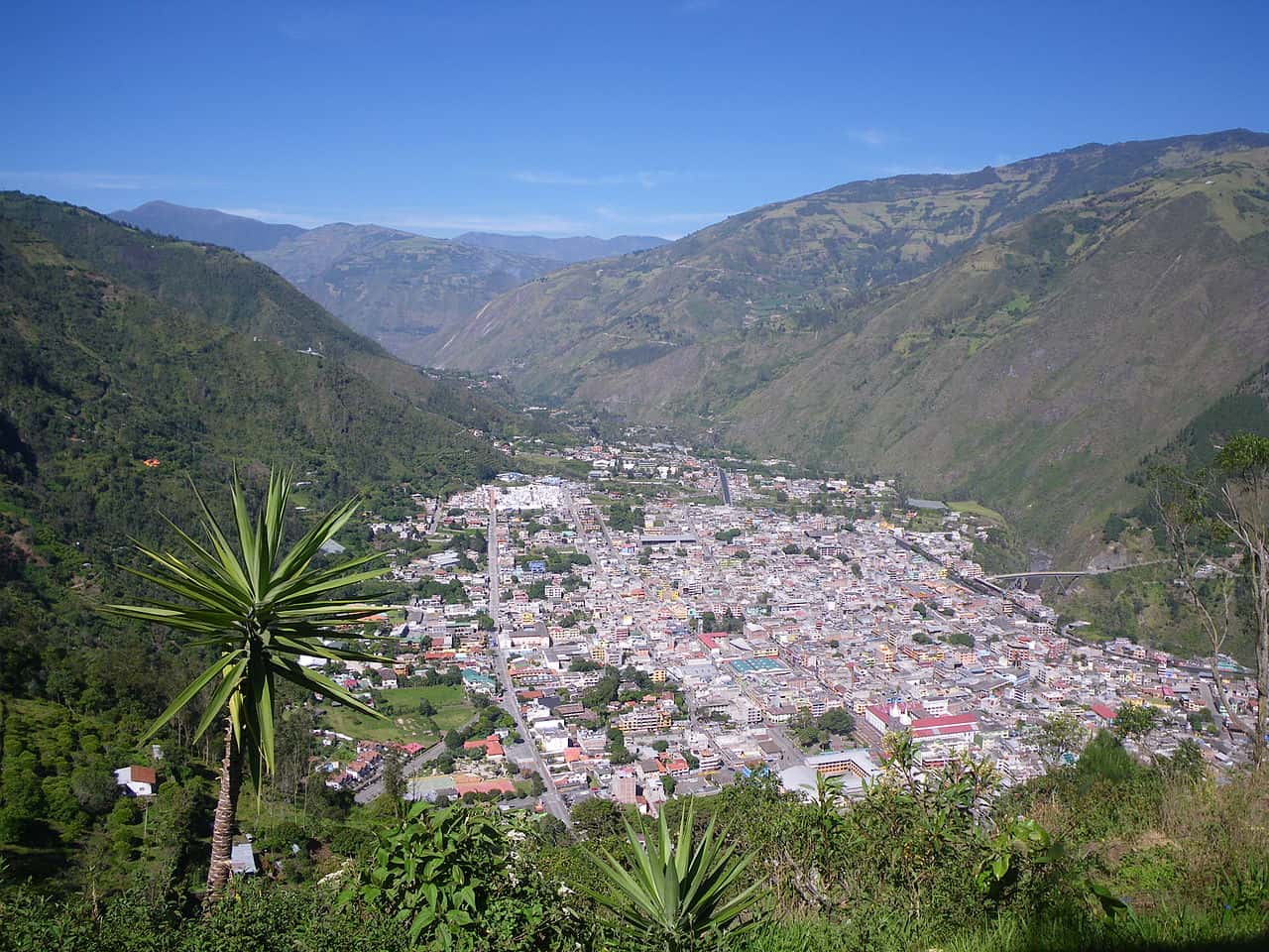 Aerial view of a valley town surrounded by mountains