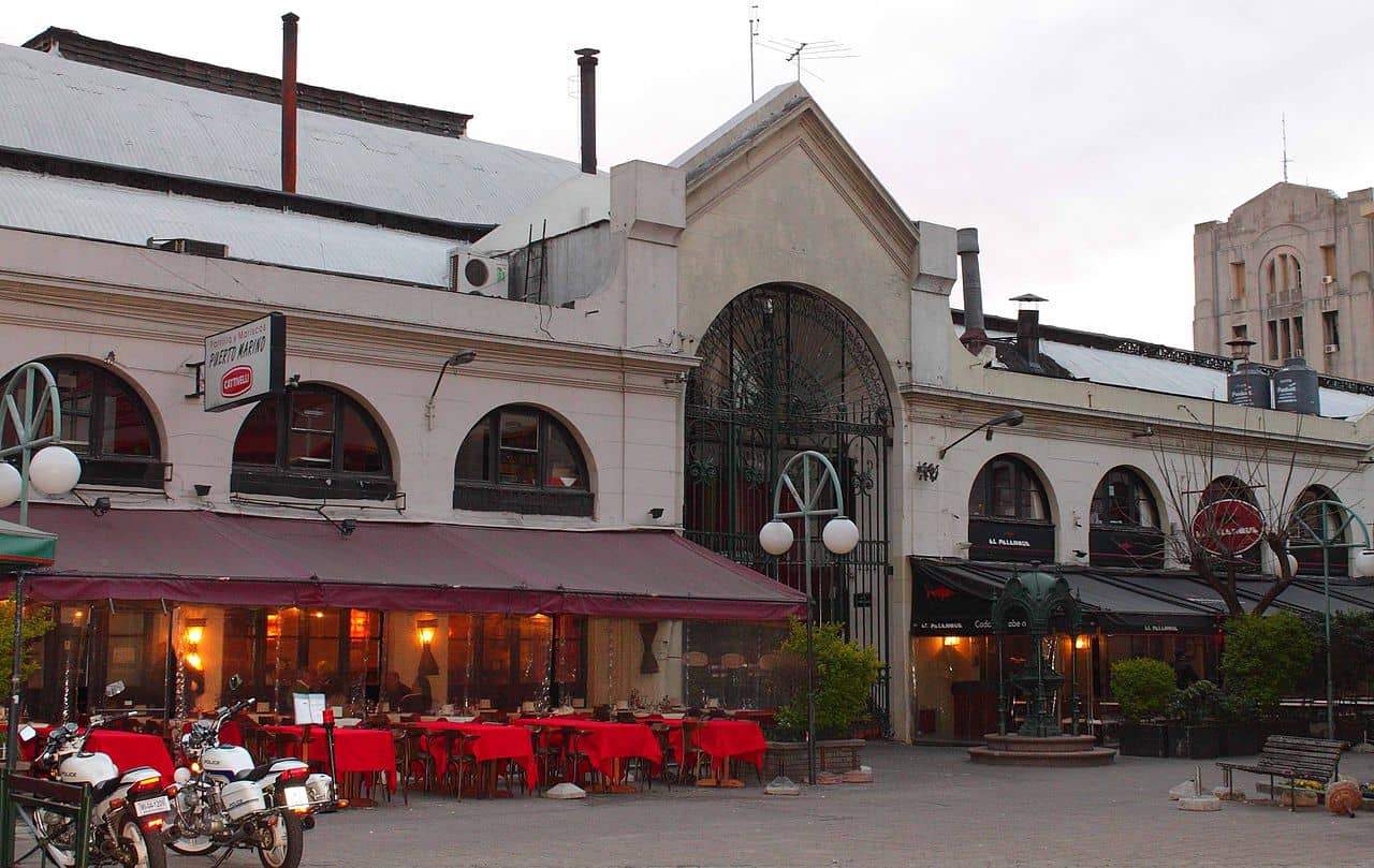 Outdoor restaurant seating with red tablecloths