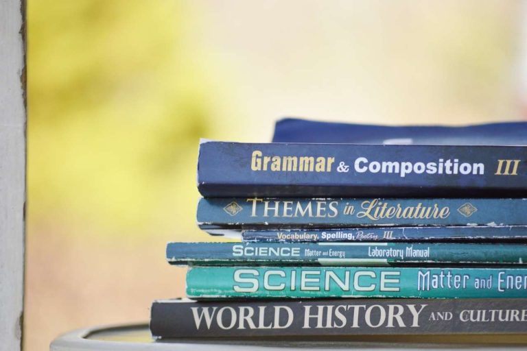 Stack of educational books on a table