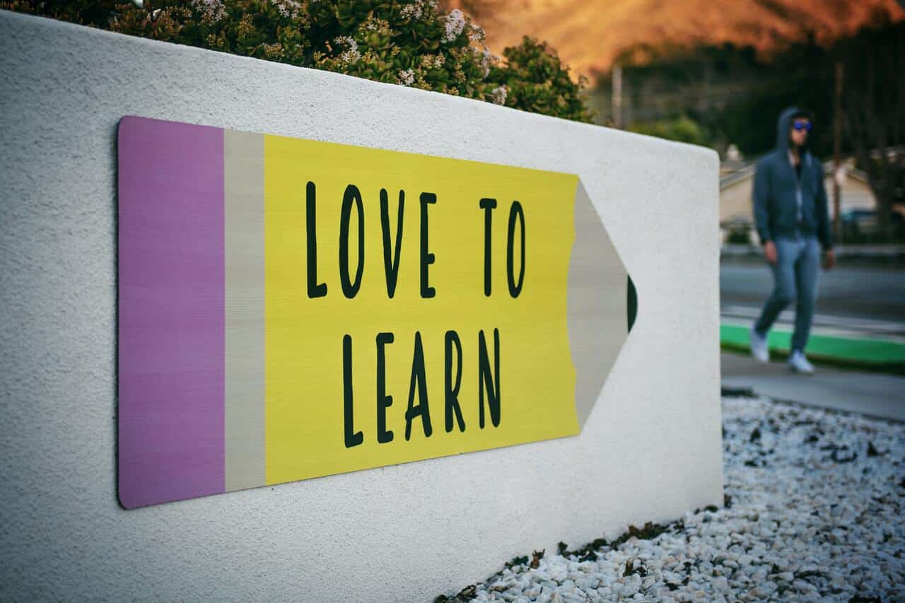 Sign with the words love to learn written