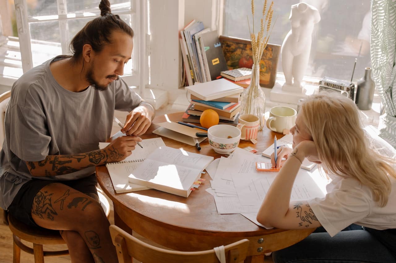 Two people studying at a table