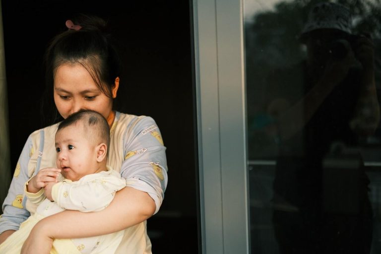 Mother holding her baby close in a quiet moment