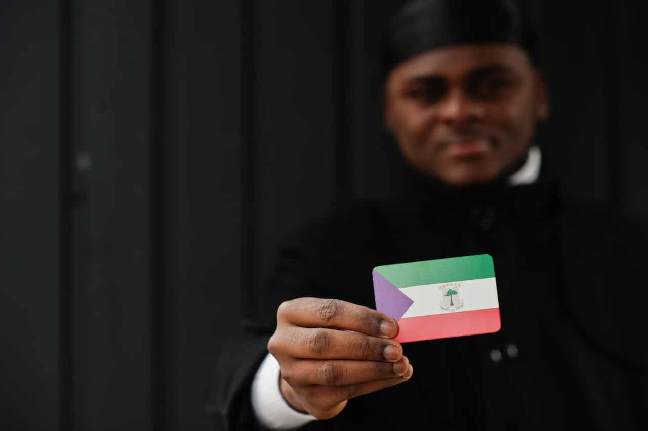 Man holding an Equatorial Guinea flag