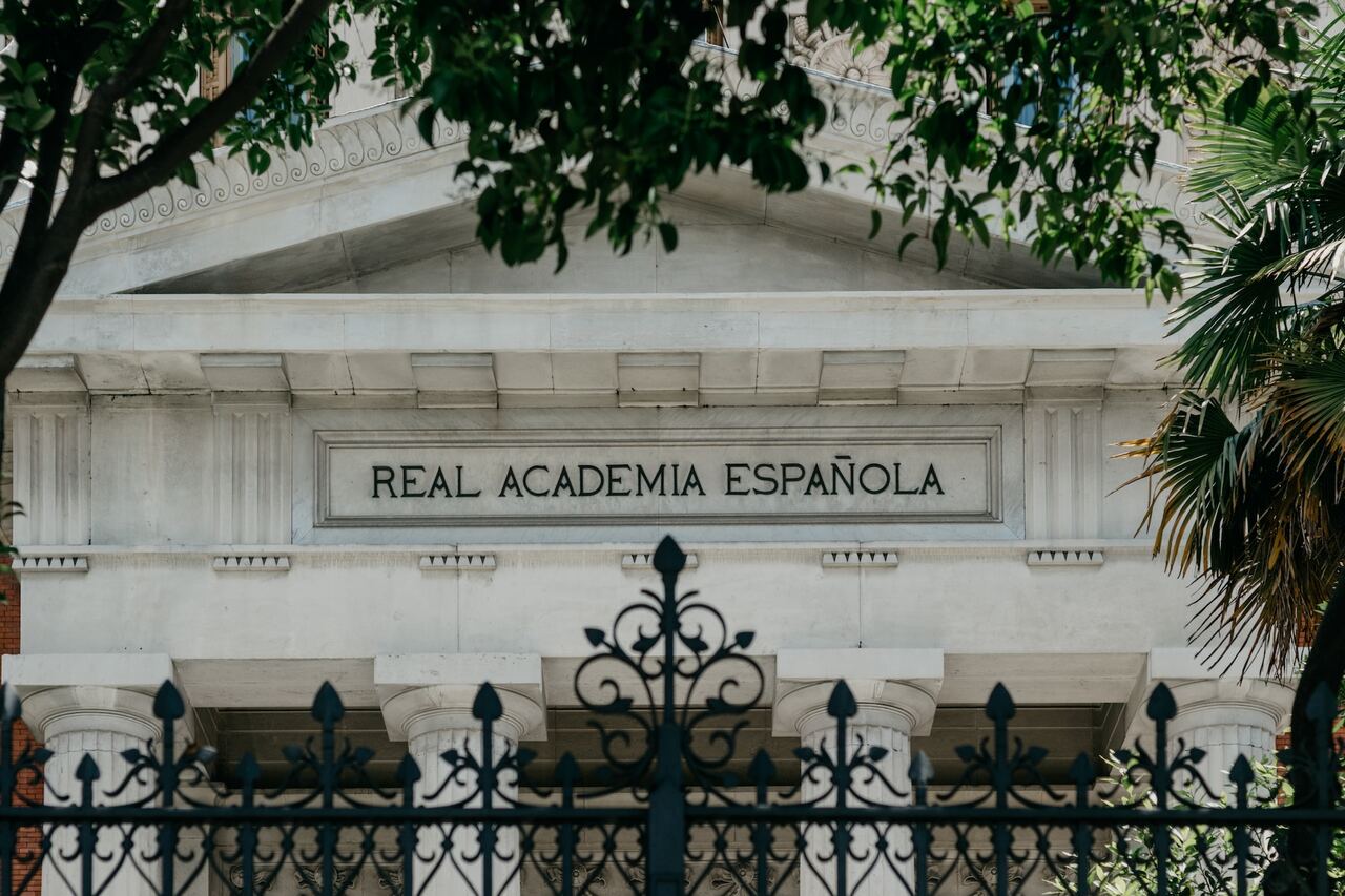 Real Academia Española” building facade behind an iron gate.