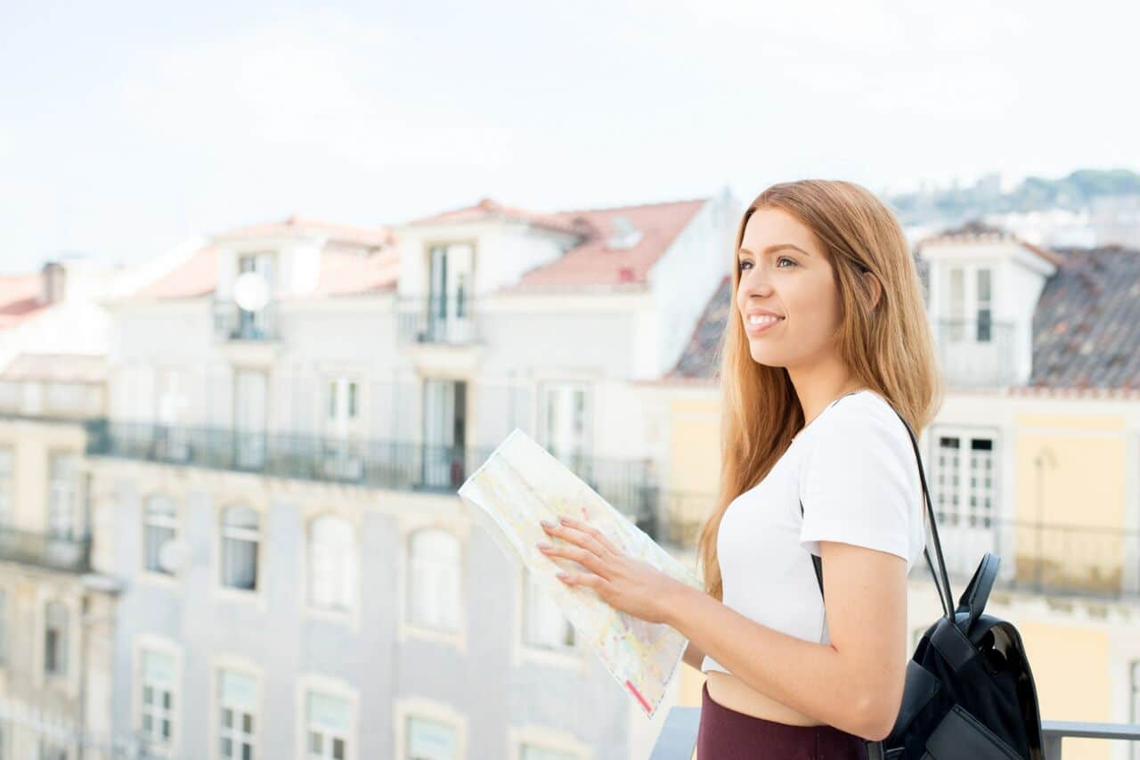 Woman holding a map outdoors