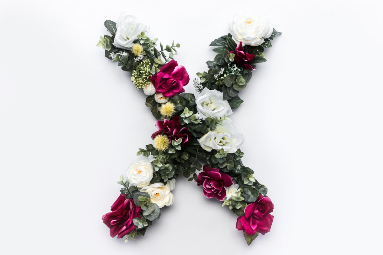 Floral arrangement shaped like the letter X