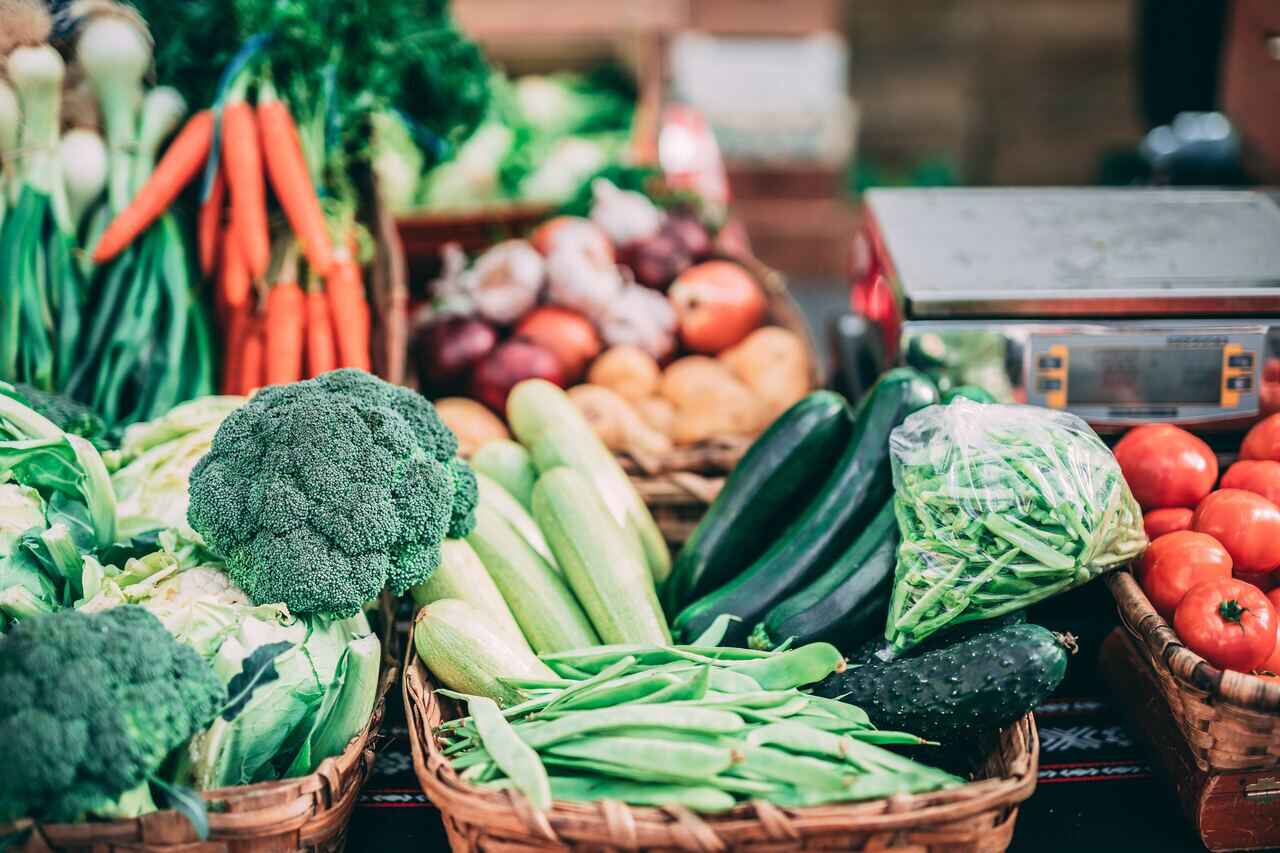 Fresh vegetables including broccoli, carrots, zucchini, and tomatoes.