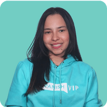 Woman in teal hoodie smiling against teal background