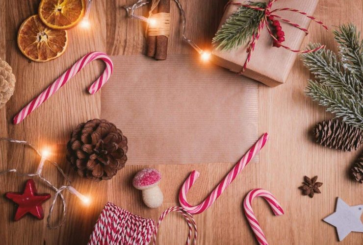 Christmas-themed decoration with candy canes, pinecones, and lights