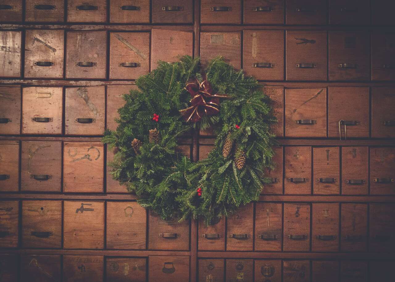 Christmas wreath on wooden drawers with rustic decor